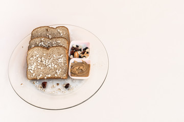 Healthy bread and seeds snack on a transparent plante over white background