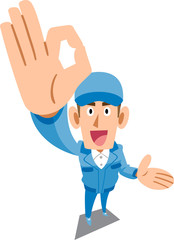 手でOKのサインを示し案内する青い作業服の男性