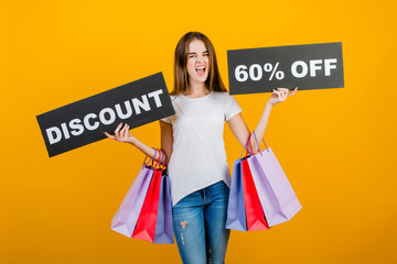 beautiful brunette woman with colorful shopping bags and copyspace text discount 60% sign isolated over yellow