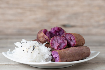 Steamed purple sweet potato in white plate