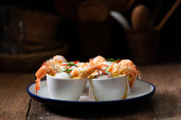 Steamed Seafood Curry Cakes with coconut cream and Prawn.
