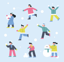 Fototapeta premium Children play with snow on a snowy day.