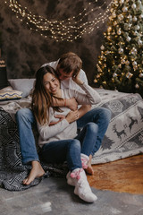 Obraz premium Romantic couple in love feeling happiness about their romance spending christmas eve together- Image