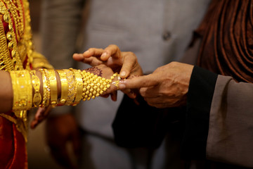 indian bride getting her ring