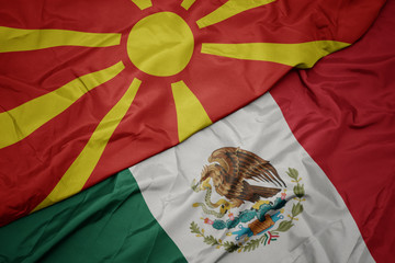 waving colorful flag of mexico and national flag of macedonia. macro