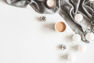 Christmas composition. Cup of coffee, scarf on gray background. Christmas, winter concept. Flat...