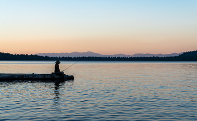 Woman Fishing in Lake Tahoe During Sunset