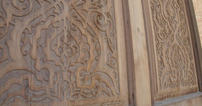 Gate carved wood pattern at Muslim religious complex, mausoleum Hazrati Imam in Tashkent, Uzbekistan. Part of the medrese is now occupied by artisans. BMPCC4K