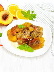 Turkey with peaches in plate