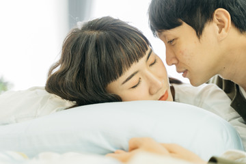 Portrait of asian couple sleeping on bed. Happy family. Love and valentine concept.