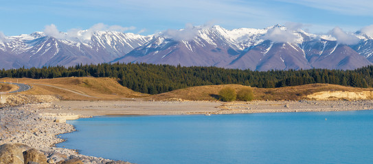 Snow capped Southern Alps and turquoise colour of Lake Pukaki,  New Zealand