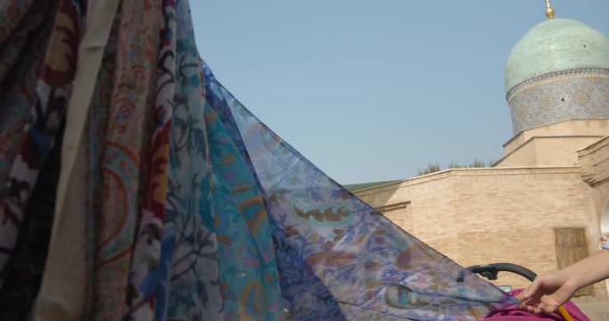 Flying silk scarf at Muslim religious complex, mausoleum Hazrati Imam in Tashkent, Uzbekistan. Part of the medrese is now occupied by artisans.