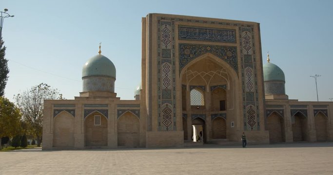 Muslim religious complex, mausoleum Hazrati Imam in Tashkent, Uzbekistan. The minarets that are close to the mosque about 50 meters high. Part of the medrese is now occupied by artisans. BMPCC4K