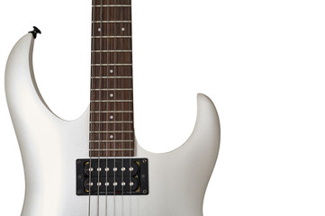 Closeup of white electric six string guitar black pickups and control knobs isolated on white...