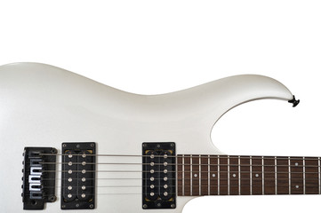 Closeup of white electric six string guitar black pickups and control knobs isolated on white background. Isolated on white background
