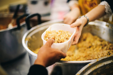 Difficult people receive free food from philanthropy through volunteers: concept of feeding and sharing