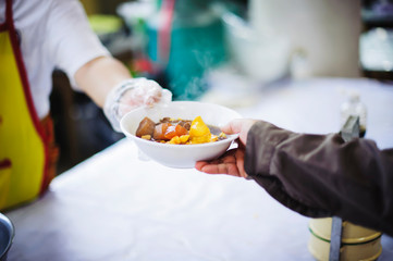 Helping the poor in society by sharing food. Charity : The concept of food donation And food needs