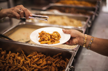 Refugee's Hands Receive Food with Starvation from a Donor's Food of Philanthropists : Concept of Hunger in Human Society