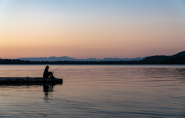 Woman Fishing in Lake Tahoe During Sunset