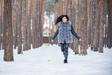 Fototapeta na wymiar Happy woman at Holiday having fun at winter snowy day, concept of positive mood