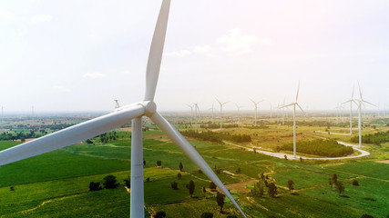 Wind turbine is alternative electrical power with blue sky, summer field, renewable energy