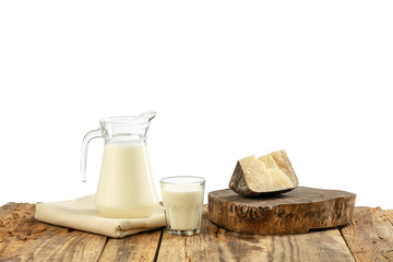 Different milk products, cheese, cream, milk on wooden table and white background. Healthy eating and lifestyle, organic natural nutrition, diet. Delicious food and drinks.