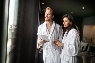 Happy couple enjoying treatments and relaxing at wellness spa center