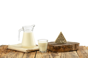 Different milk products, cheese, cream, milk on wooden table and white background. Healthy eating and lifestyle, organic natural nutrition, diet. Delicious food and drinks.
