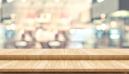 Empty step wood table top ( food stand ) with blur customer dining at cafe restaurant background...