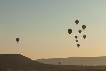 hot air balloons over the village of Göreme in Cappadocia