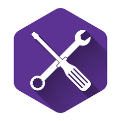 White Spanner and screwdriver tools icon isolated with long shadow. Service tool symbol. Purple hexagon button. Vector Illustration