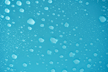 Water drops on blue background.