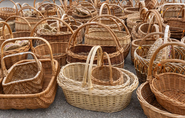 Wicker baskets made of straw. Russian craft and handmade souvenirs