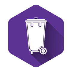 White Trash can icon isolated with long shadow. Garbage bin sign. Recycle basket icon. Office trash icon. Purple hexagon button. Vector Illustration