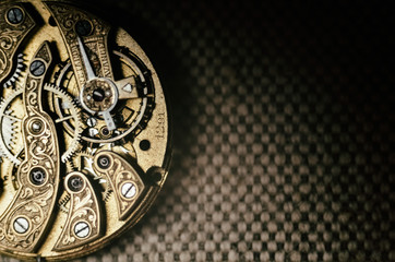  Close up inside mechanical vintage watch. Handmade engraving. Concept eternity, teamwork. Soft...