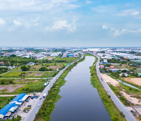 Aerial view of river with industrial sites.