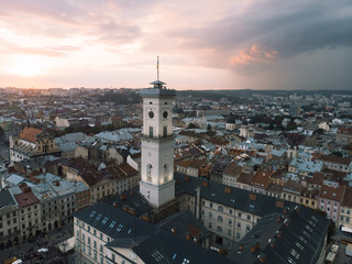 Obraz premium aerial view of lviv bell clock tower on sunset overcast sky