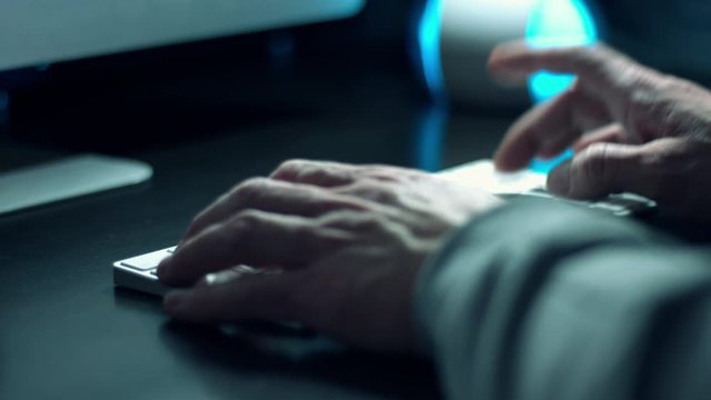 Coder typing code in python language using wireless computer keyboard