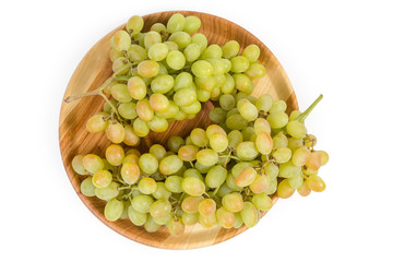 Top view of sultana grape clusters on vintage wooden dish