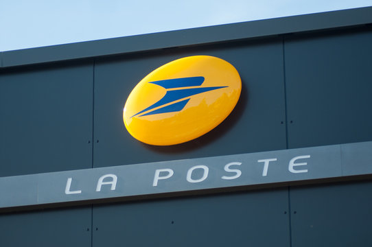 Lutterbach - 27 October 2019 - Closeup of la poste sign and logo on agency facade