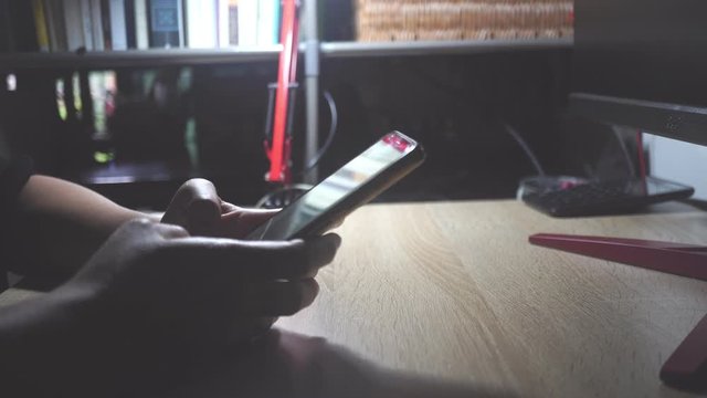 4K video woman hand using smartphone or tablet to do business, financial social network  with coffee cafe nature background