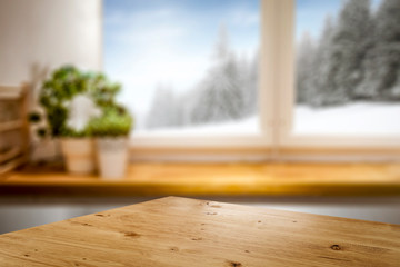 Desk of free space and winter window background 