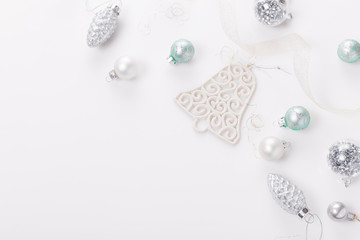 Christmas composition. Christmas balls, blue and silver decorations on white background.