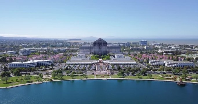 aerial water front view of metro center tower in foster city near Visa Global HQ on hills dale blvd drone fly forward