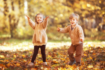 Funny twins in autumn park - 298822179