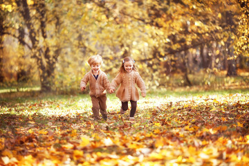 Funny twins in autumn park - 298822189