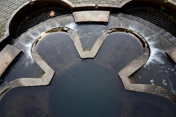 Photo of a waterfall. Autumn park on the shore. Image of nature, forest, landscape.