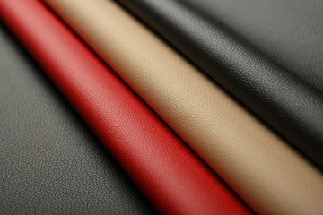 Background of black, red and beige white leather