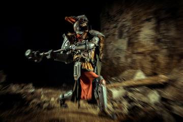 Attack of a powerful knight in the armor with the hammer. Dungeon on the background.