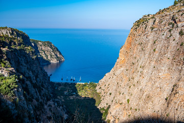 Fototapeta na wymiar The Butterfly Valley (kelebekler vadisi) in the city of Oludeniz/Fethiye in western Turkey. You can only reach this valley by boat or rock climbing